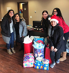 Multicultural Club delivers holiday cheer to Haven House in South Sioux City